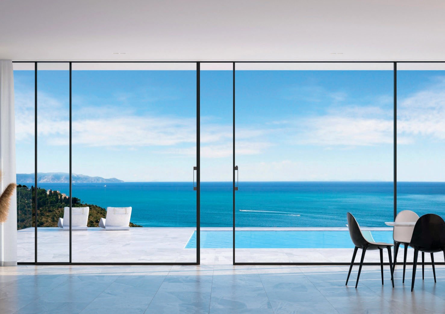 Full-height minimal-frame sliding glass wall open to a sea view