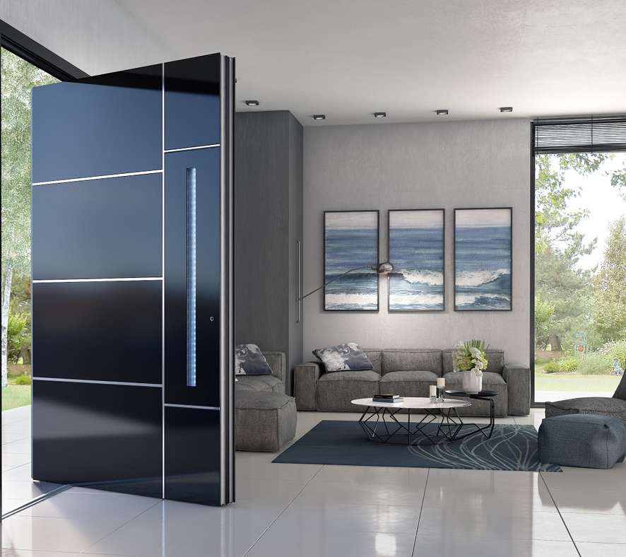 Dark blue aluminum pivot entrance door open into a modern living room